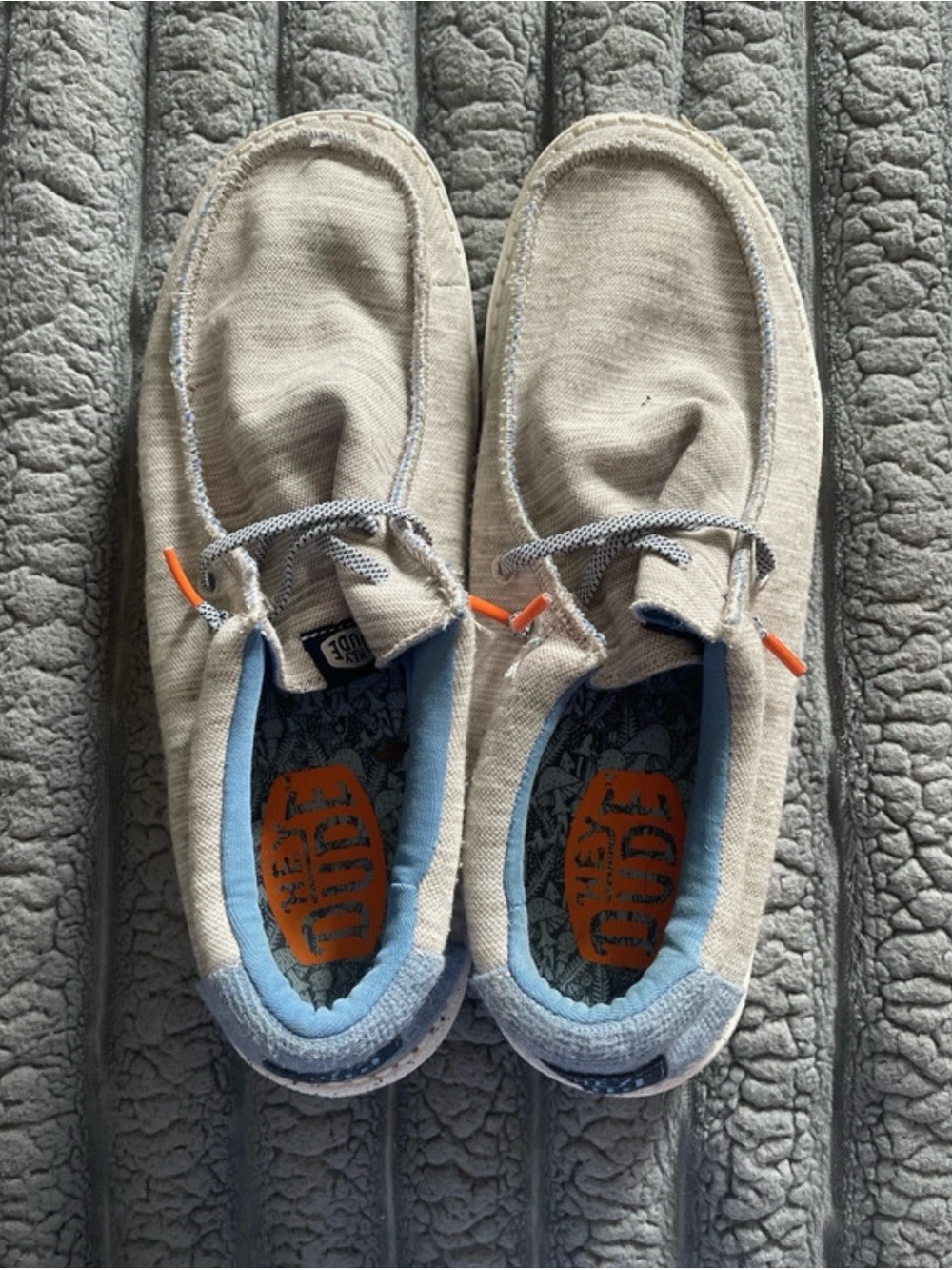 Men’s Hey Dude Canvas Slip-On Sneakers with Light Blue Trim and Orange Accents